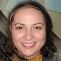 Young woman sharing a positive experience with a friendly smile.